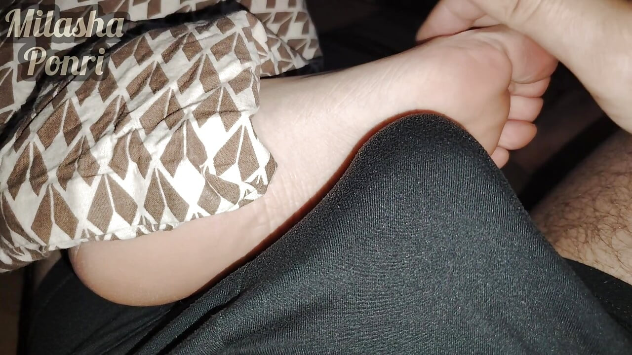Stepsister's feet get a light massage while watching a movie