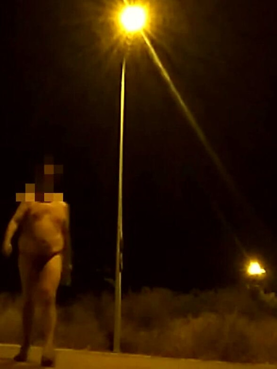 Crossing the street naked at night