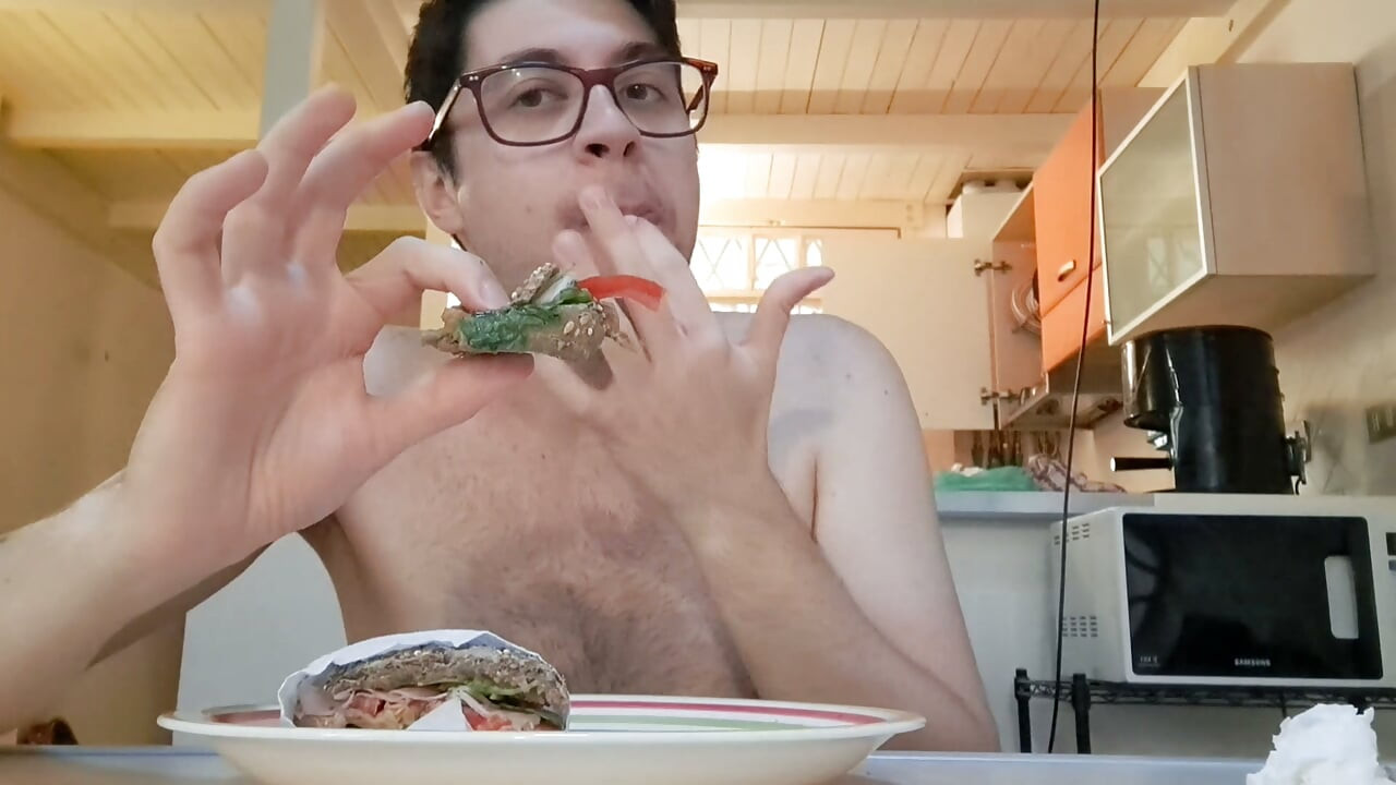 Pig guy eats a sandwich while jerking big cock