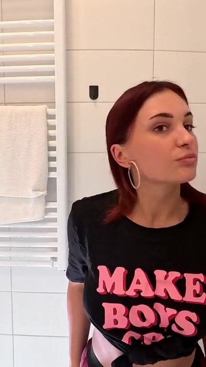 Hottest redhead ever in the bathroom touches herself in a super short college mini skirt | Clip 1