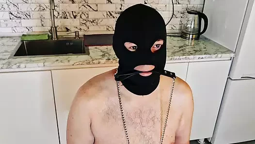 Anal games in the kitchen. Dominatrix Nika fucks her slave's ass with a cucumber.