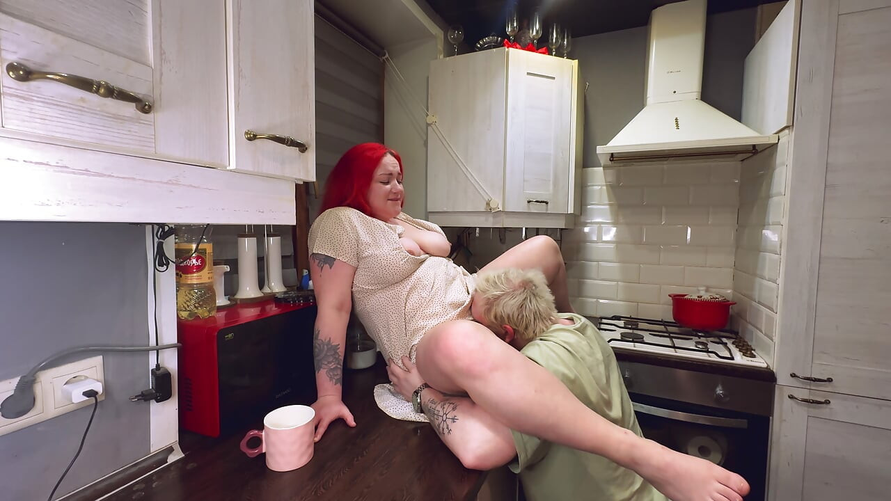Sex in the kitchen with a red-haired wife. .