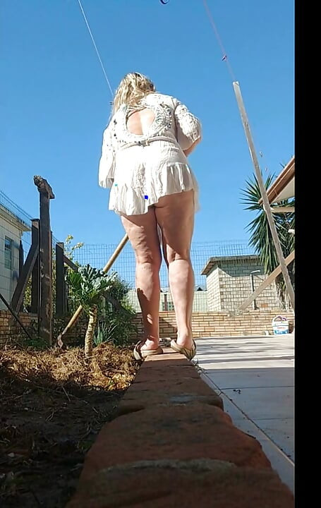 My stepmom showing off in public in the Garden without panties.