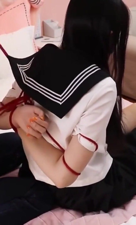 Gg50 - Cute Girl Challenges Herself to Break Free From the Restraints of Ropes and a Single Glove on the Bed.