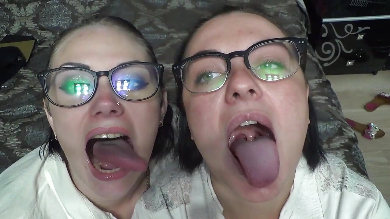 Two business women taunt you with their mouths & tongues before eating you whole!