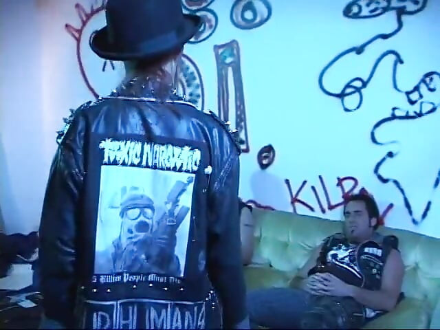 Rebellious young brunette in leather jacket sucks and takes two cocks