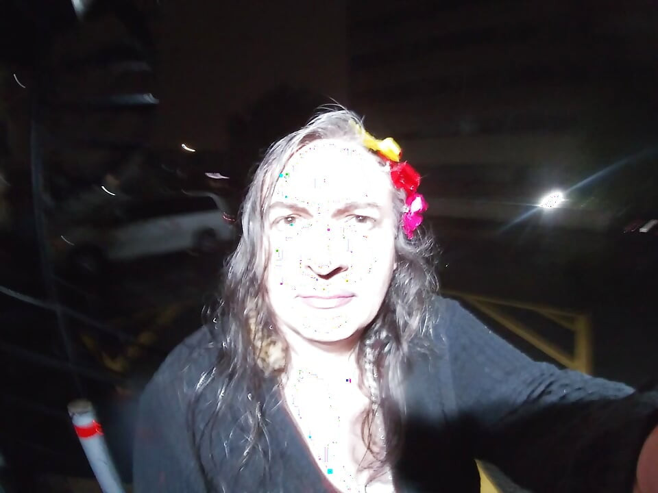 Mature sissy CD out in the rain in A parking lot in public masturbation.