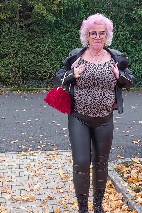 Naughty Granny Tongue Out Flashing Big Tits in Public