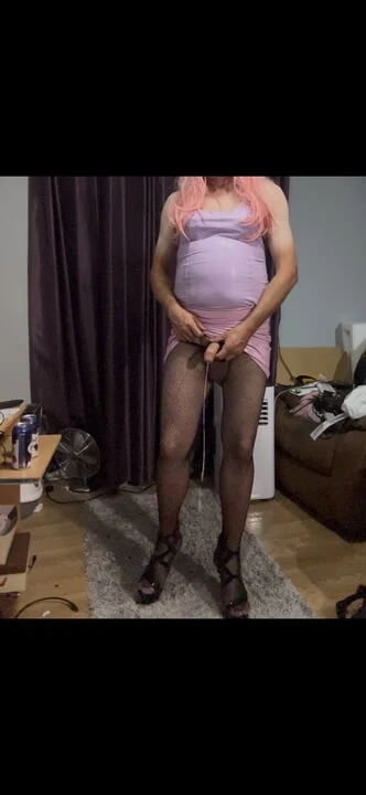 Dressed in pink pvc, fishnets and high heels and edging with lots of cum