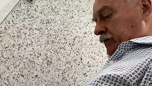 Moustached grandpa pissing