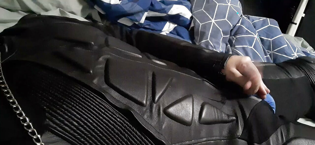 Biker cums in leather moto race suit