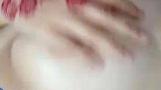 Indonesian girl massaging her boobs