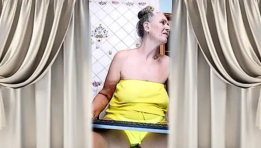 Cheerful Housewife Lukerya Shows Her Bare Feet in Kitchen. Mature Soles and Toes Close Up