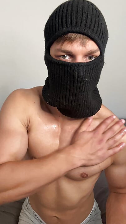 Masked horny hunk oiled up and teasing