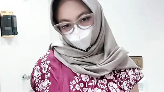 Fountain of a girl in a batik daster dress