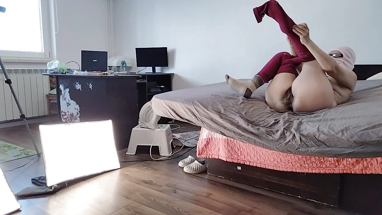 Sexy Latina Having Fun Trying on Clothes and Cutting Them.