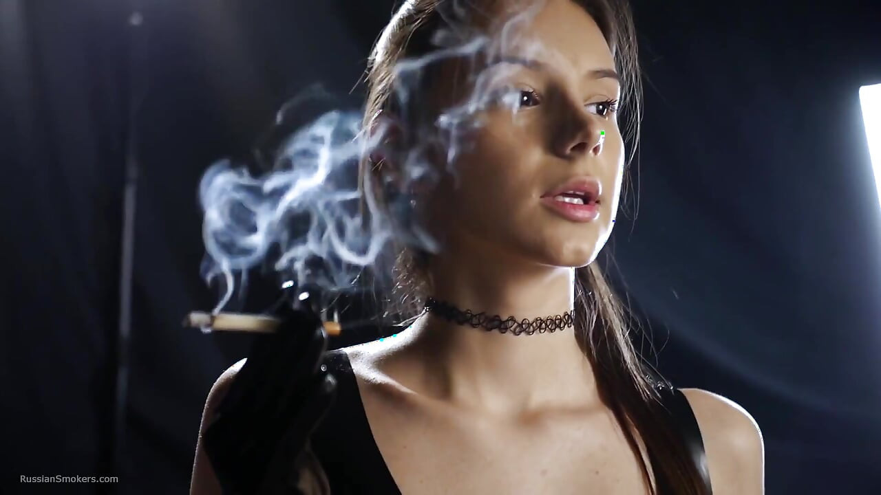 Brunette Smoking in Black Latex Outfit Slow Sensual Scene