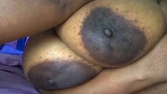 Monster black tits with huge areola on laid out BBW