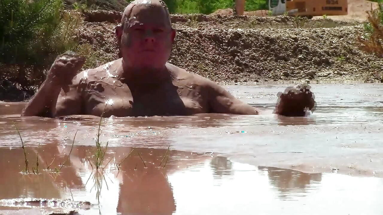 Deep, Creamy Brown Mud Bath in a Sand Pit