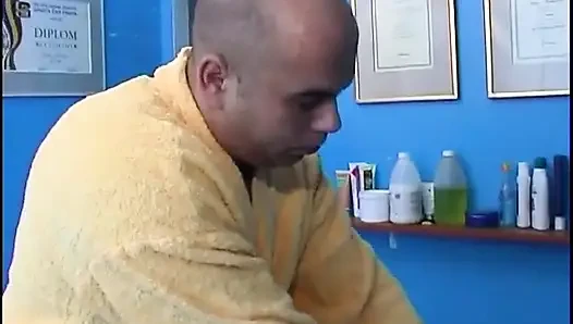 Masseur banging twink on the massage table