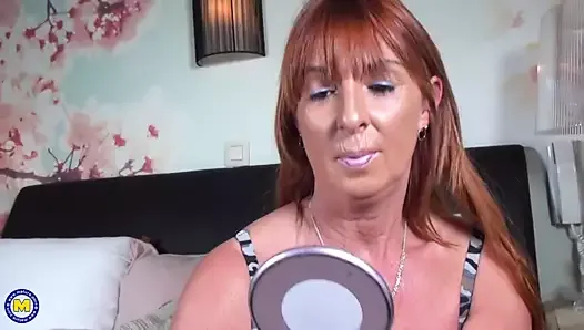 Redhead mature mother feeding her pussy