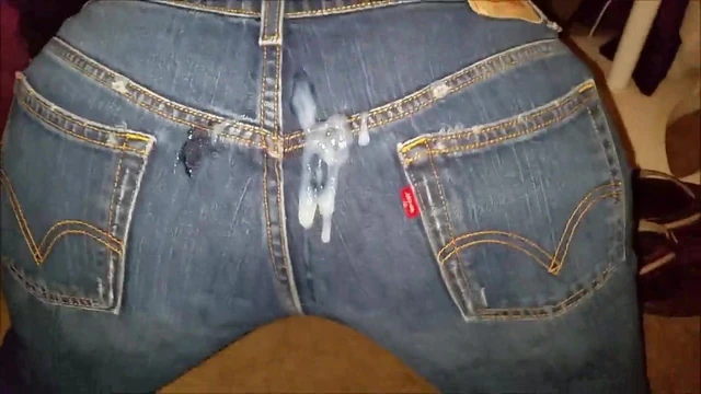 Releasing a load of cum on her jeans