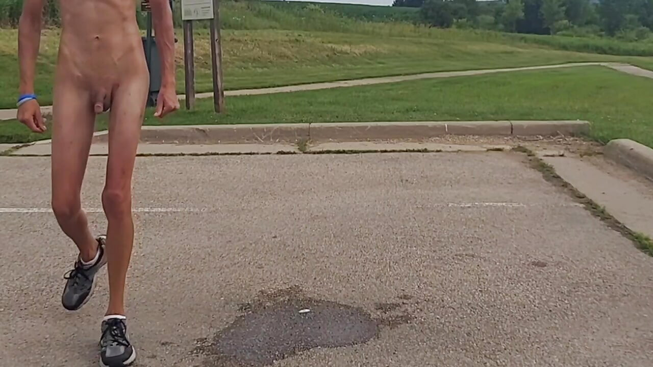Naked and pissing in parking lot