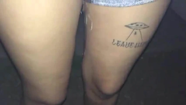 Close-up grey shorts peeing while standing outdoors 1