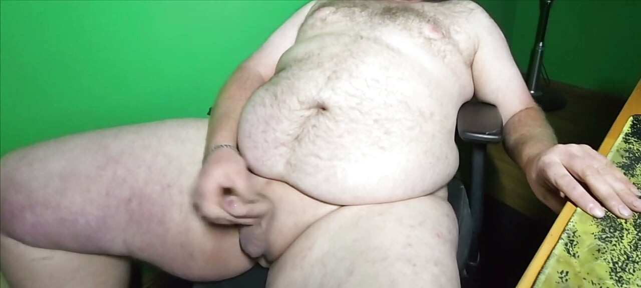 A fat boy with a small dick is masturbating.