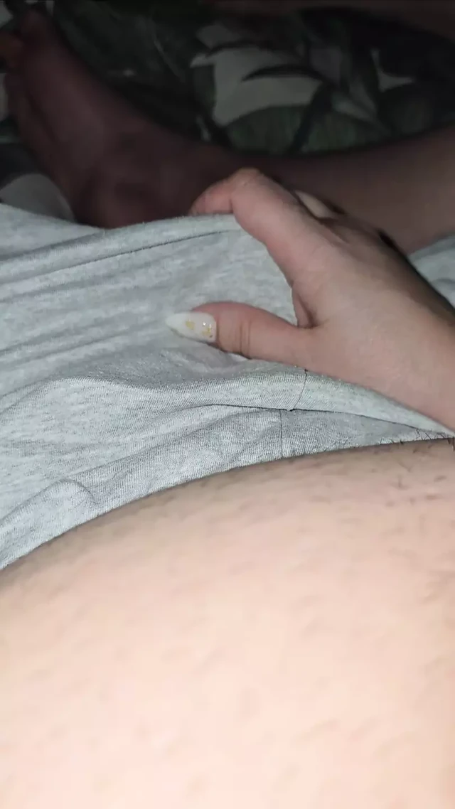 Step mom hand sneaking into step son pants touching his big dick for handjob