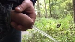 Uncut cock pissing in the woods