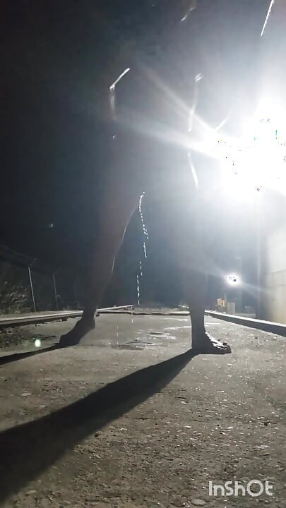 Naked and Pissing on the Train Tracks