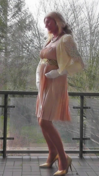 Memorable moment from "Wanking On A Winday Day In My Shiny Pleated Satin Gown"