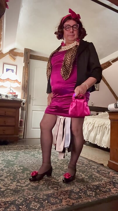 Dressed in a short fuchsia dress for an evening out