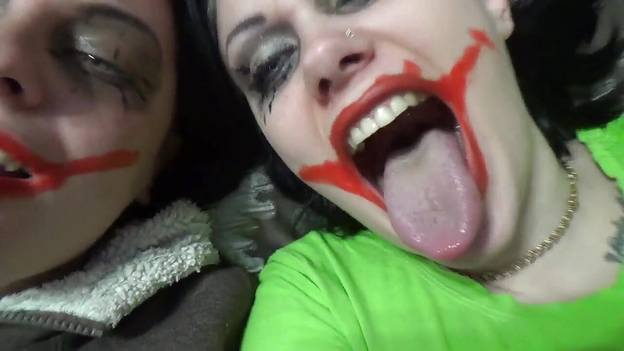 Two crazy clown girls dangle you above their hungry mouths before fighting over who will eat you alive