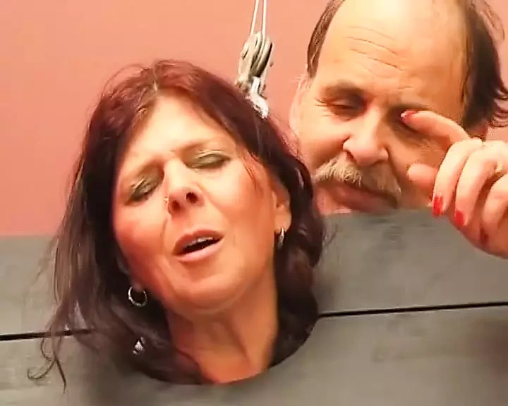 Chubby German slut sprayed with wax in BDSM scene