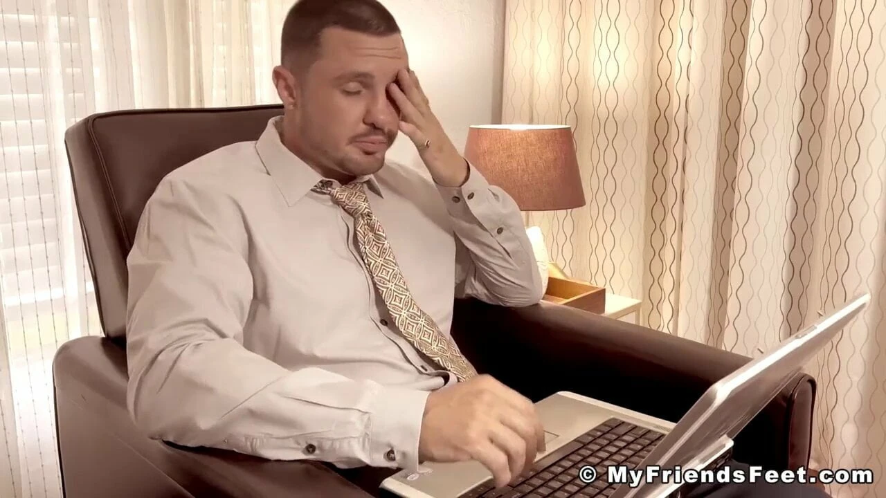 Businessman has his feet and toes sucked one by one by gay