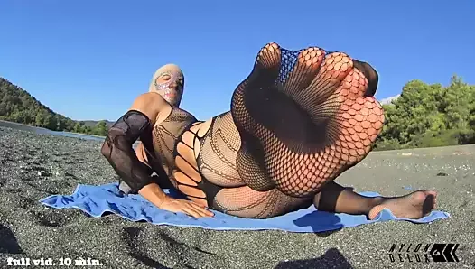 nylondelux bodysuit on public beach