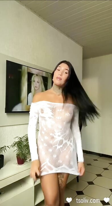 Sexy latina Trans loves stripping away her see through dress for her fans