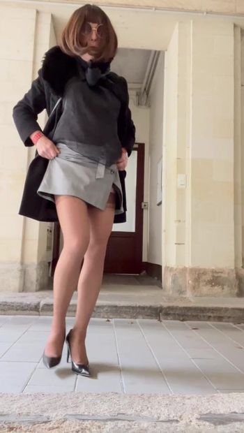 Outdoor in nylon stockings, miniskirt and high heels