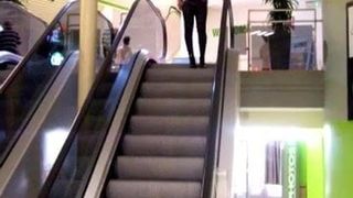 femmeboi on escalator