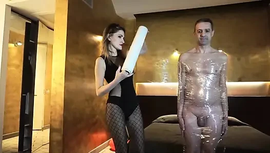 Femdom girl puts her slave in tape bondage