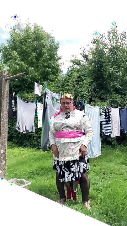 In gardening outfit to hang the laundry