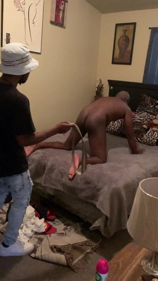 Black guy gets spanked on hand and knees