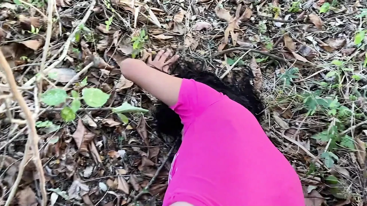 I find her outdoors and running inside a girl in the woods.