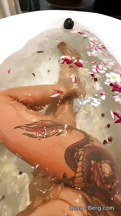 Bath of Blossoms Naked MILF Masturbates Among Flowers