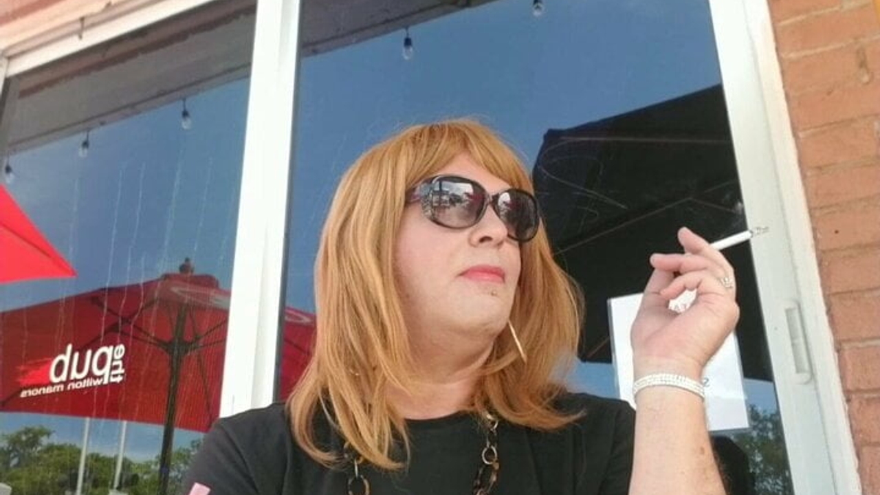 Tranny smoking and drinking at bar