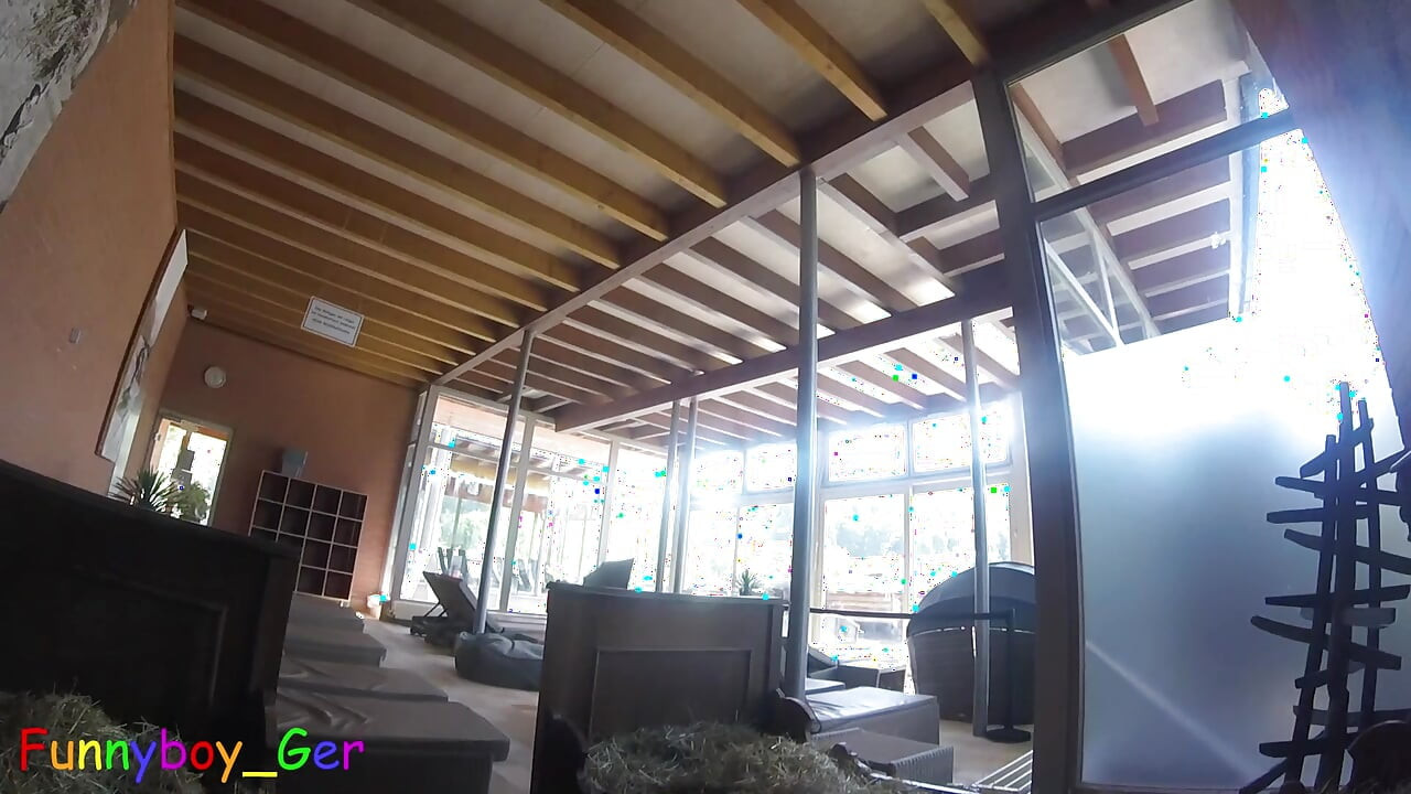 Naked in a bed of hay in a public relaxation room, I jerk off my thick penis, shown from various angles.