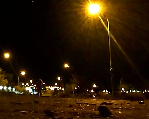 Naked on a quiet street at night