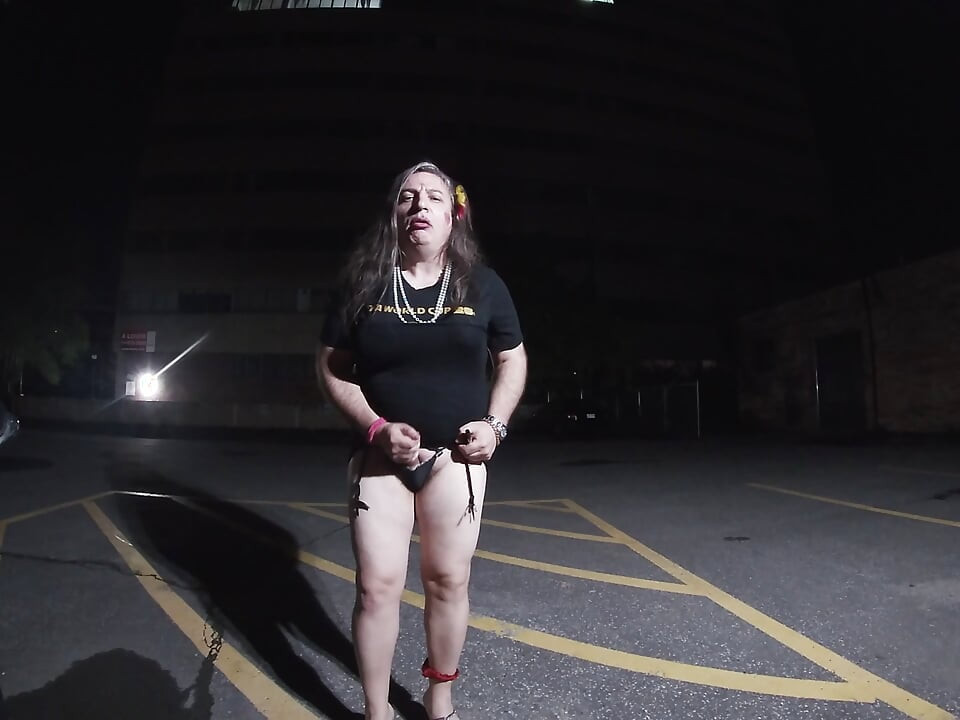 Solo feminized Mature CD goes for a walk in a parking lot